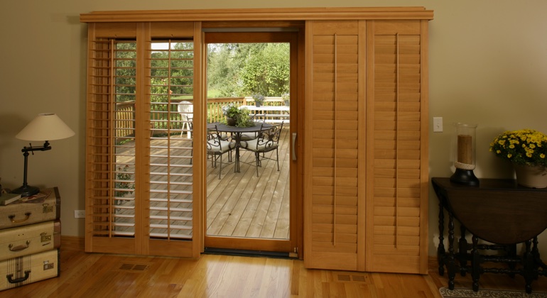 You can even match your wood shutters to your patio. Salt Lake City wood shutter sliding door